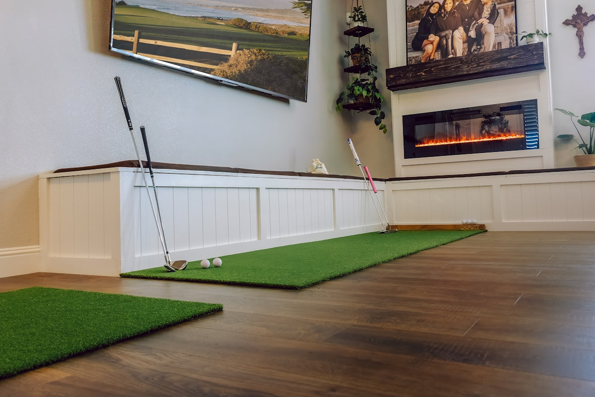 Golf putting green set up in a living room.